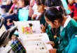 Estudiantes de telesecundarias rurales recibiendo libros del programa "En Michoacán se Lee".