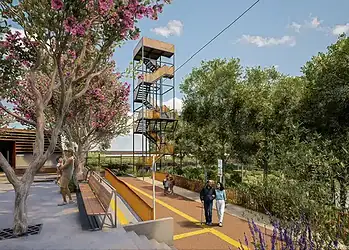 Escalera de cuerda con zona de paseo y árboles verdes, en parque o atracción outdoor.